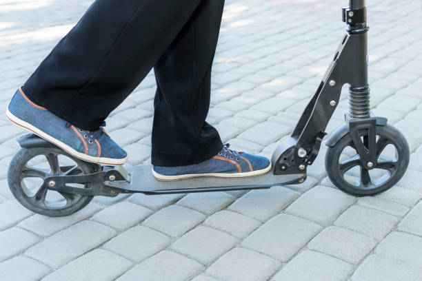 istock Legs brake on the scooter 1004035322