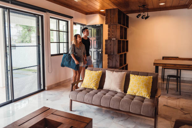 istock A young couple comes home from trip 1004040132