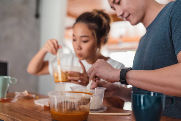 istock Young Asian couple having lunch 1004040576
