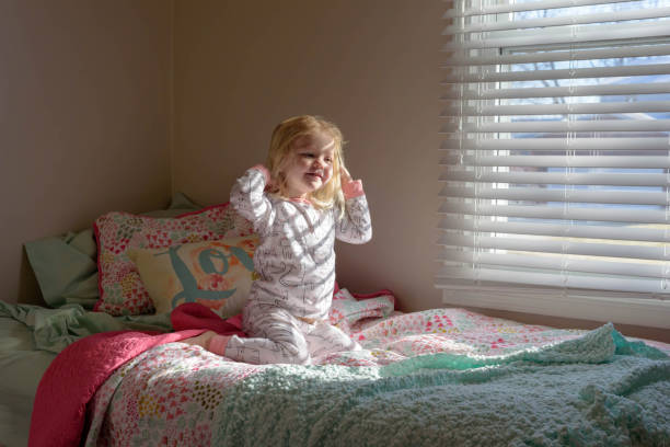 istock Cute Girl On Bed At Home 1004044514