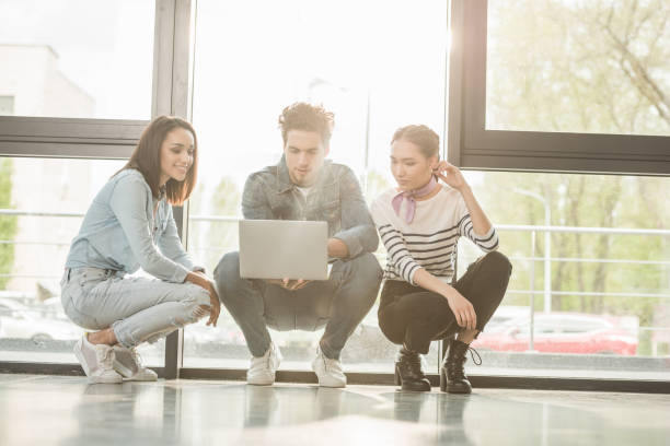 istock Business people working with laptop in modern light office 1004045316