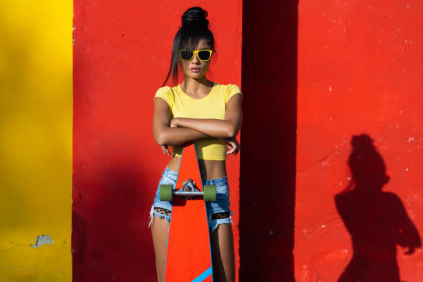 istock Beautiful skater leaning on skateboard 1004045826