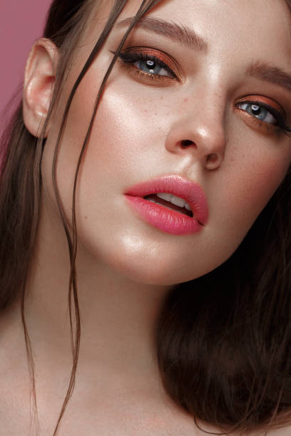 istock Beautiful girl with creative colorful makeup. Beauty face. 1004048586