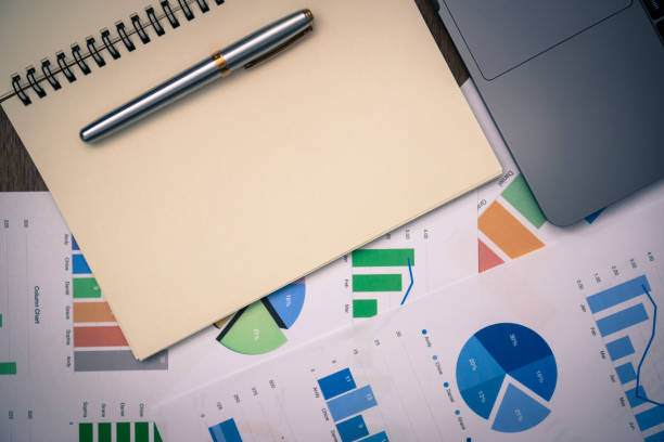 istock business documents on office table with smart phone and digital tablet and graph financial with social network diagram and computer laptop on wood desk 1004052490