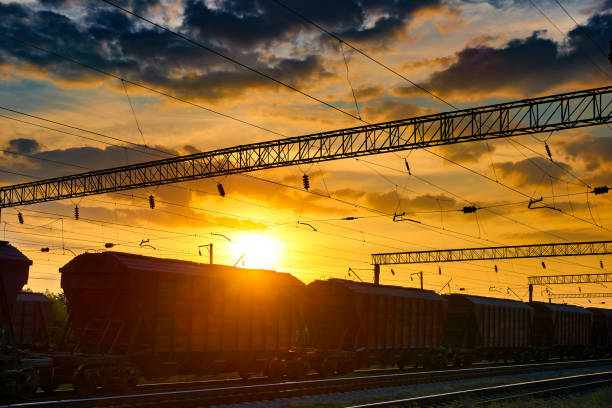 istock railroad infrastructure during beautiful sunset and colorful sky, railcar for dry cargo, transportation and industrial concept 1004057490