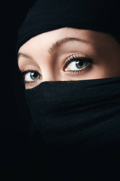 istock Woman face close up with only eyes visible 1004057806