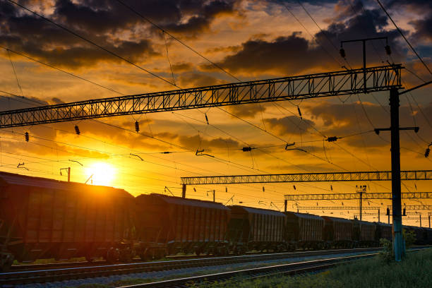 istock railroad infrastructure during beautiful sunset and colorful sky, railcar for dry cargo, transportation and industrial concept 1004057934