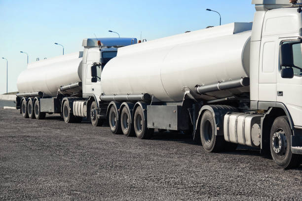 istock two white tank trucks on the road, clear and blank space on the 1004060982