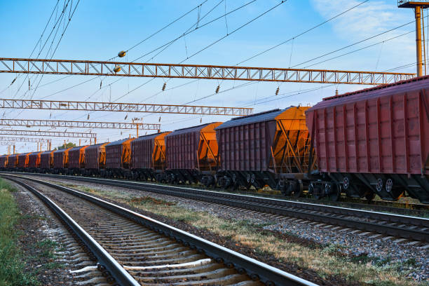 istock railroad infrastructure during beautiful sunset and colorful sky, railcar for dry cargo, transportation and industrial concept 1004061178