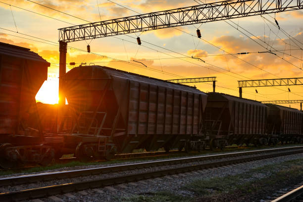 istock railroad infrastructure during beautiful sunset and colorful sky, railcar for dry cargo, transportation and industrial concept 1004061306