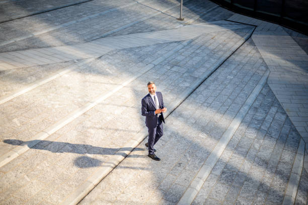 istock Overview of a smiling businessman. 1004081990