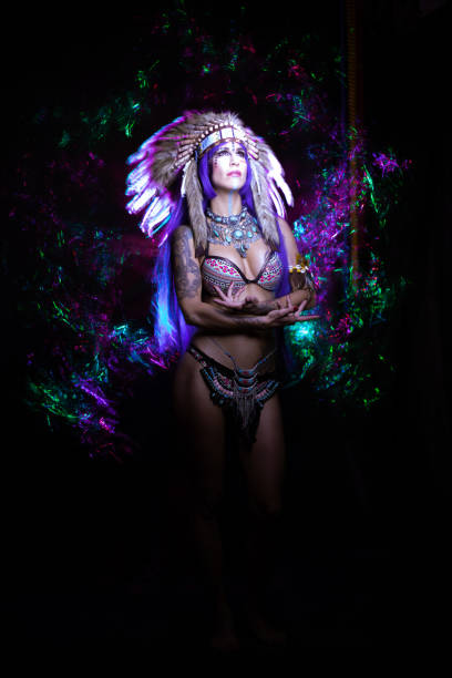 istock Indian woman among colored lights 1004086746