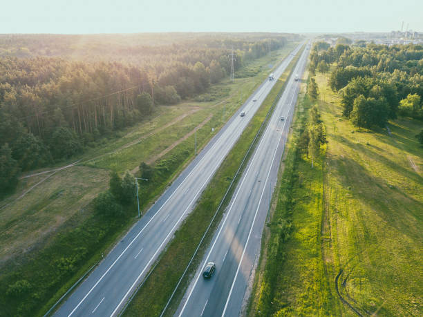istock Aerial View Of Road Passing Through Landscape 1004089344