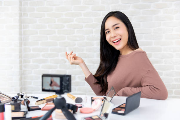 istock Beautiful Asian woman professional beauty vlogger recording makeup tutorial 1004108972