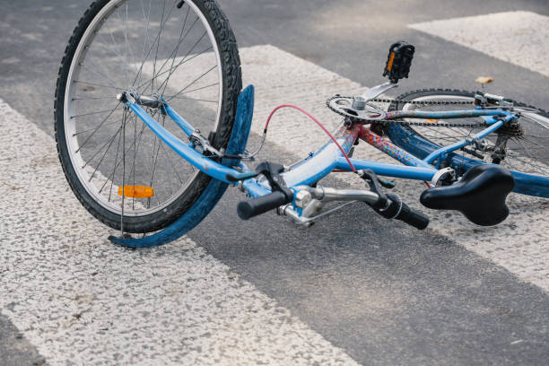 istock Blue child's bicycle on a pedestrian lines after traffic incident 1004109218