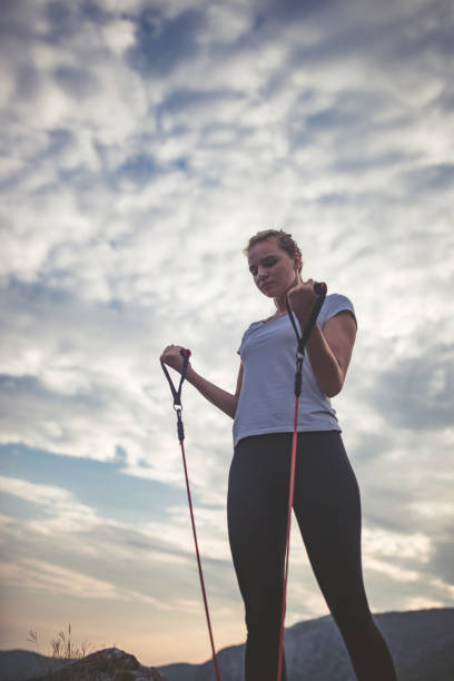 istock Exercising on top of the mountain 1004109394