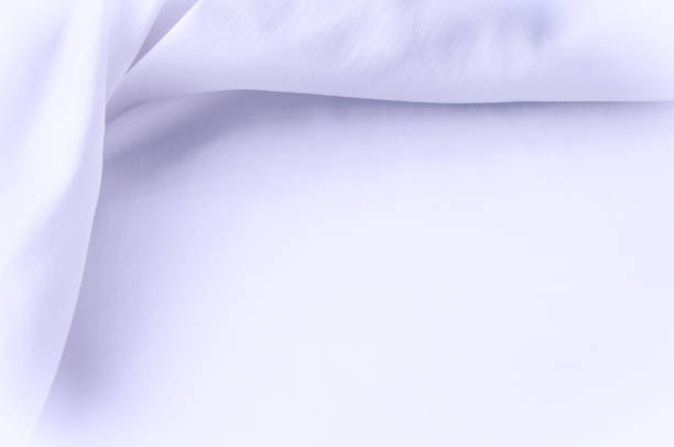 istock Texture background of fabric. Blue white cloth. Silk fabric wallpaper texture background pattern in sepia pastel blue cream blue white shade tint: Lovely natural silk textured textile 1004113036