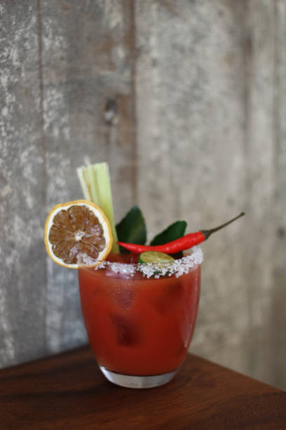 istock Cocktail Taken Against Grey Plaster Wall Background 1004114154