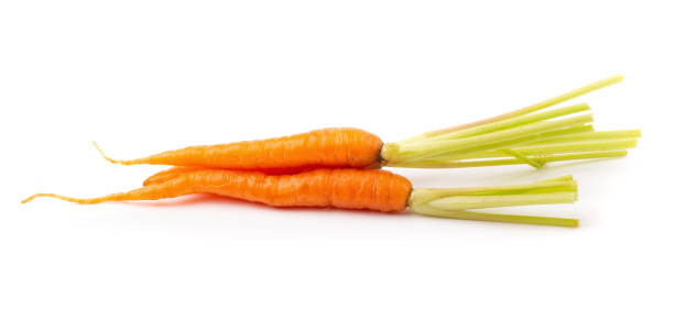 istock Fresh baby carrots isolated on a white background 1004117590
