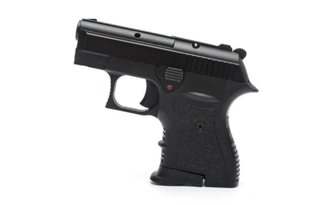 istock automatic pisto, handgunl on a white background 1004118170