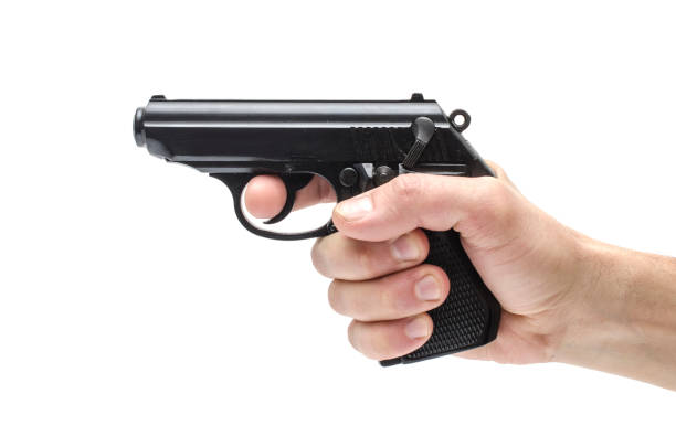 istock Gun, pistol in hand isolated on white 1004118360