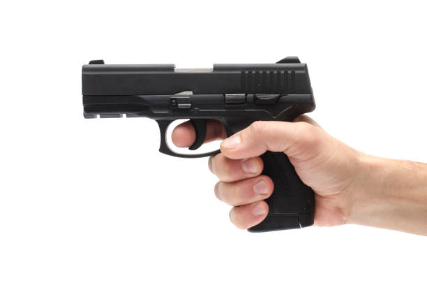 istock Gun, pistol in hand isolated on white 1004118370