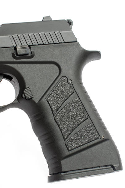 istock handle of pistol isolated 1004122262