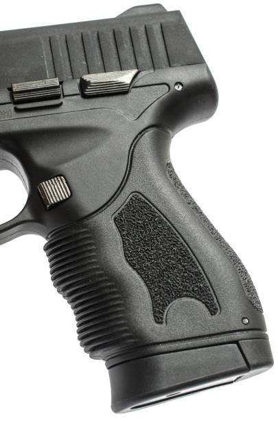 istock handle of pistol isolated 1004122296