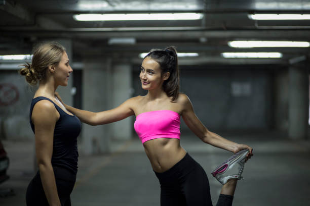 istock Two young adult females having training session 1004146502