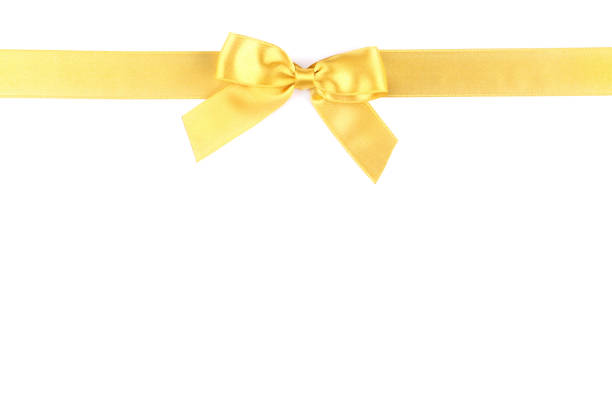istock Golden bow with ribbon isolated on white background 1004174408