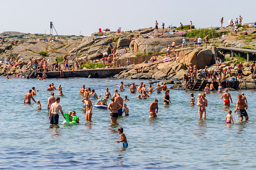 Varberg, Sweden - July 16, 2015:  People bathing in the sea on the holiday