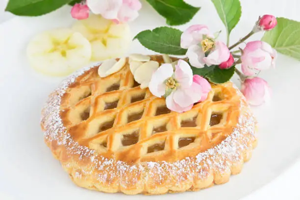 small apple pie with apple tree blossom