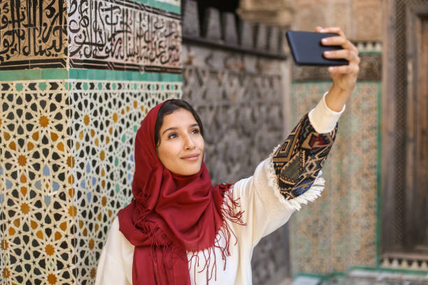 istock Arab woman taking a selfie 1004198932
