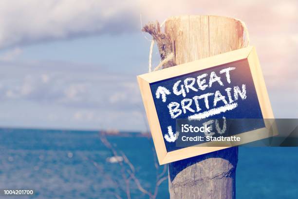 Sea Beach And A Sign With Arrows To Britain And The European Union Eu Stock Photo - Download Image Now