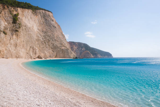 istock White beach, blue ocean and green rocks 1004202544