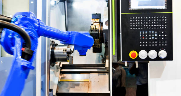 istock Robot arm working in a factory 1004205378