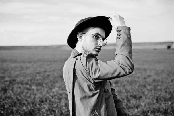 istock Stylish man in glasses, brown jacket and hat 1004206234