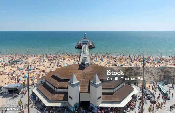 High Above Bournemouth Pier On A Summers Day With A Crowded Beach Stock Photo - Download Image Now