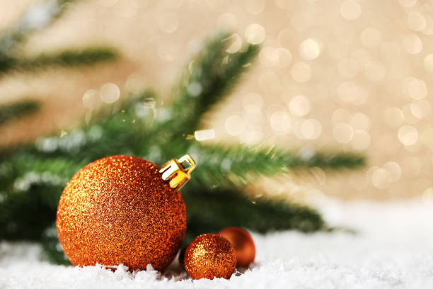 istock New christmas baubles with fir-tree branches on lights background 1004214038