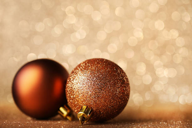 istock New christmas baubles on lights background 1004216338