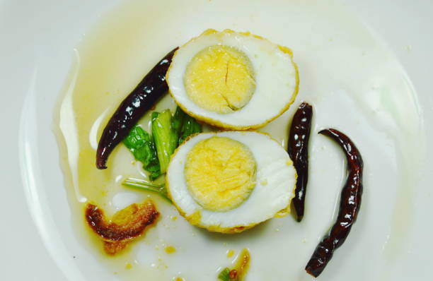 istock fried egg half cut dressing sweet tamarind sauce topping chili 1004225228