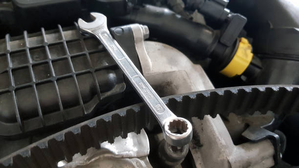 Spanner and timing belt on car engine Spanner and timing belt on car engine ready for service repair belt stock pictures, royalty-free photos & images
