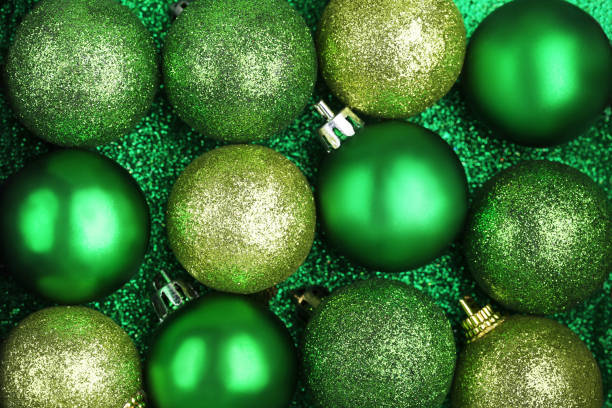 istock Green christmas baubles background 1004226162