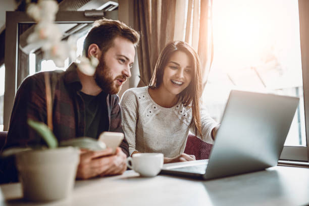 istock Young Couple Surfing The Net For Vacation Accommodation 1004226930
