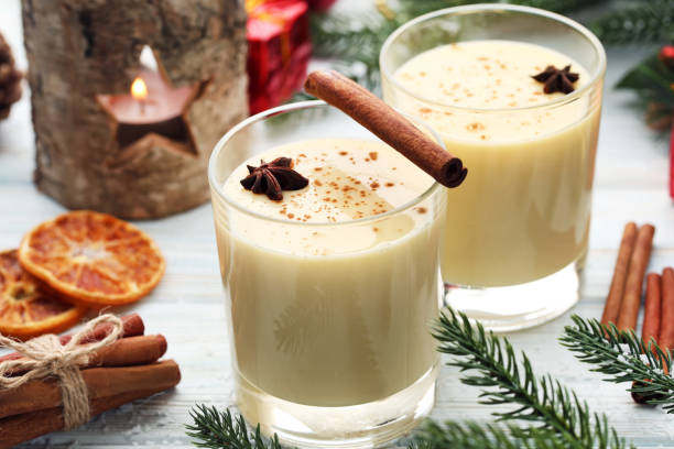 istock Eggnog in glasses with cinamon and star anise on wooden table 1004232022