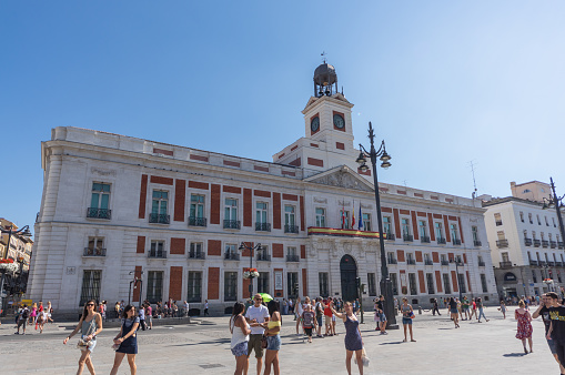 Real Post House (Real Casa de Correos) in famous Square of Puerta del Sol in Madrid, Spain, during the summer of 2018.