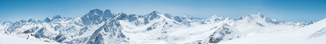 Winter snow covered mountain peaks in Caucasus. Great place for winter sports.