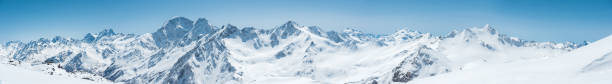 Winter snow covered mountain peaks in Caucasus. Great place for winter sports stock photo