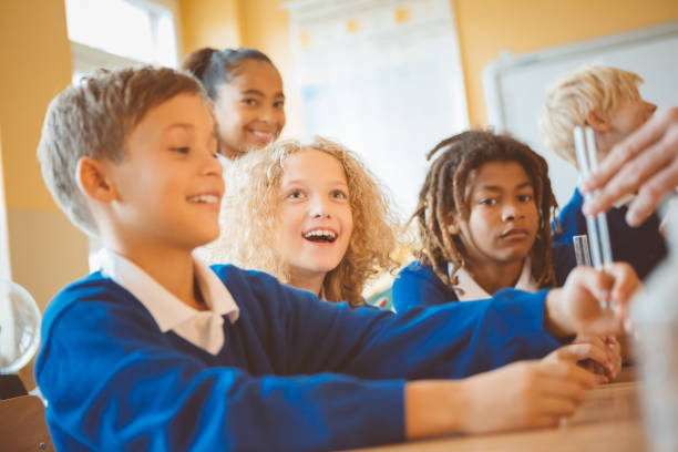 istock School children having fun in chemistry lab 1004255492