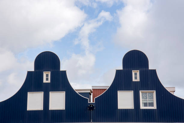 Traditional Dutch building with a modern office block towering behind, Rotterdam, Netherlands